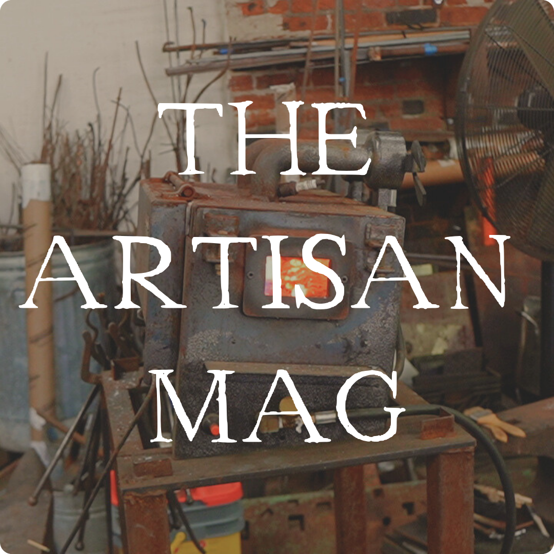 Image of a forge with rustic text over it that says "The Artisan Mag"