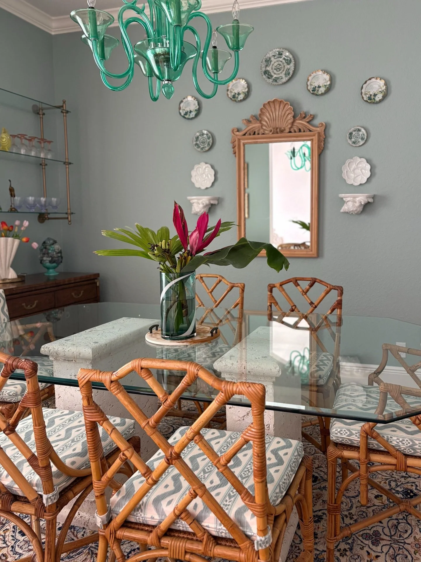 Visiting a dining room refresh recently completed.

The mission was to improve the overall aesthetic of the dining room while incorporating some of my clients favorite elements. One request was a glass topped dining table, so we replaced the previous