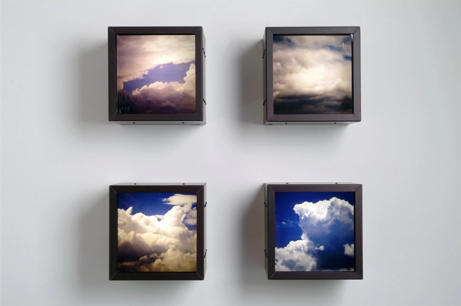 Black Boxes | 13" x 13" x 9" (each) | duratrans prints, anodized aluminum, lights, glass