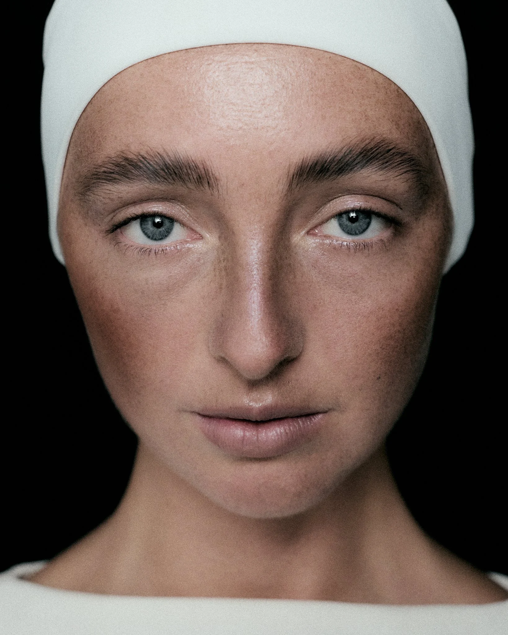 Person wearing white headband, close up beauty shot