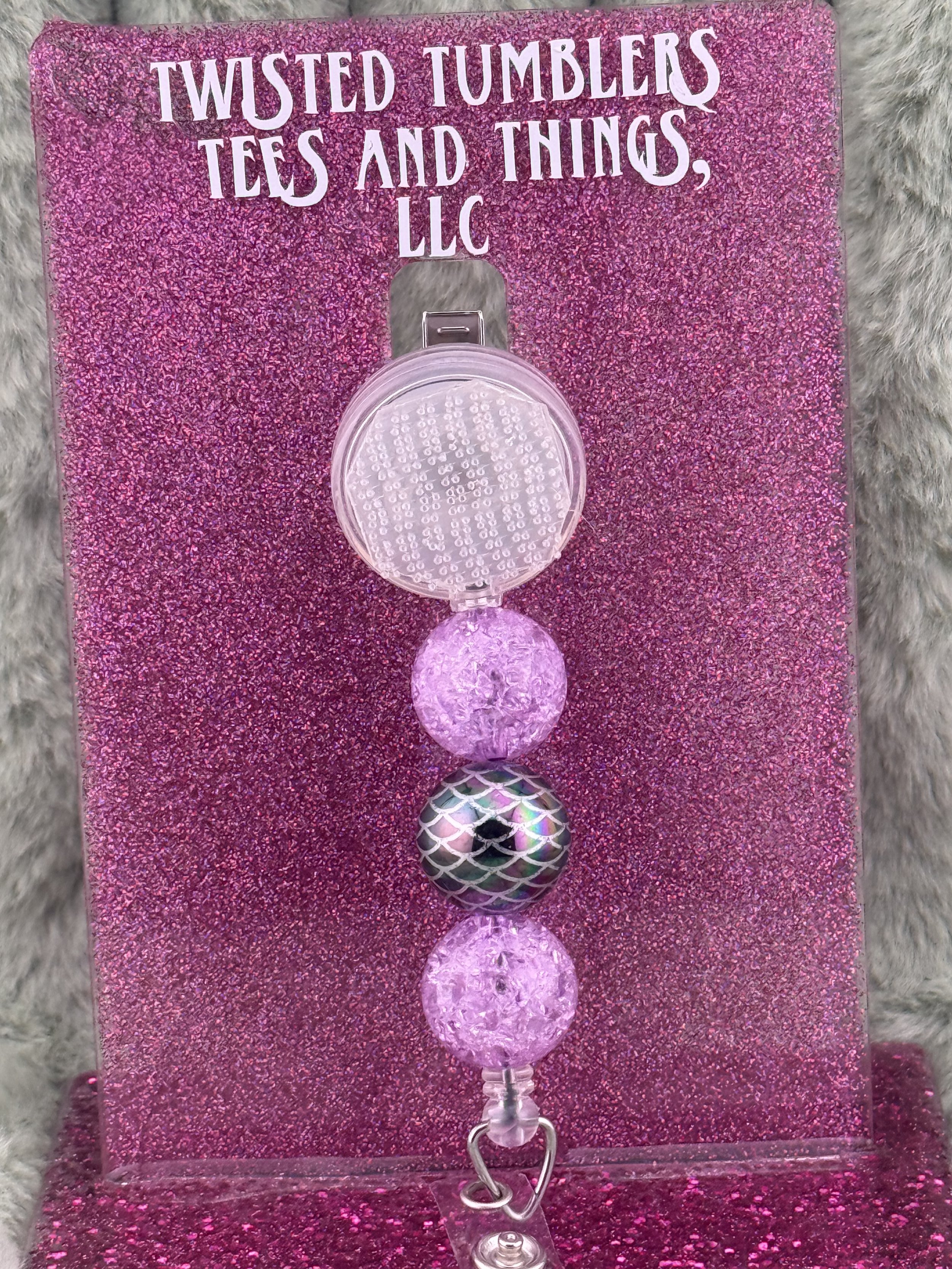 3 Bead Statement Badge Reel- 1  black metallic bead and 2 purple crackle beads