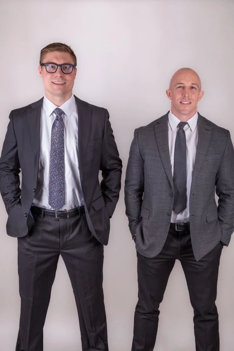 Attorneys Jacob Diviney and Ethan Wilt standing together in a professional portrait