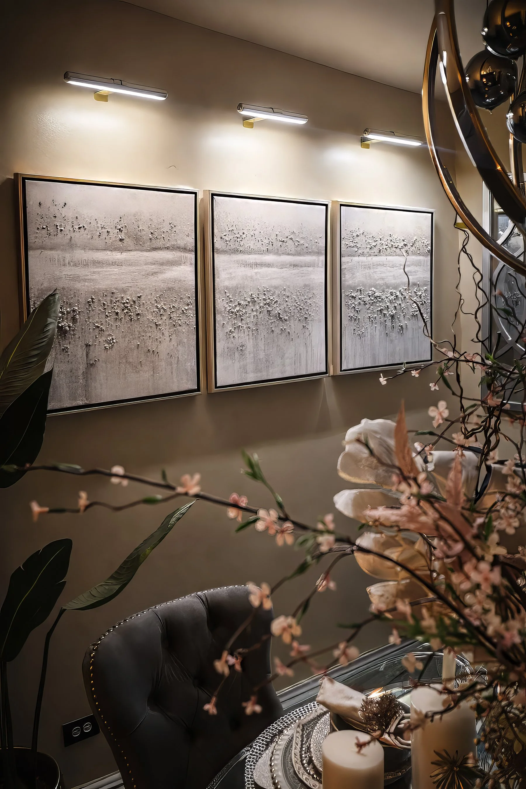 Black and white dining table with textured frames and soft centerpiece focus