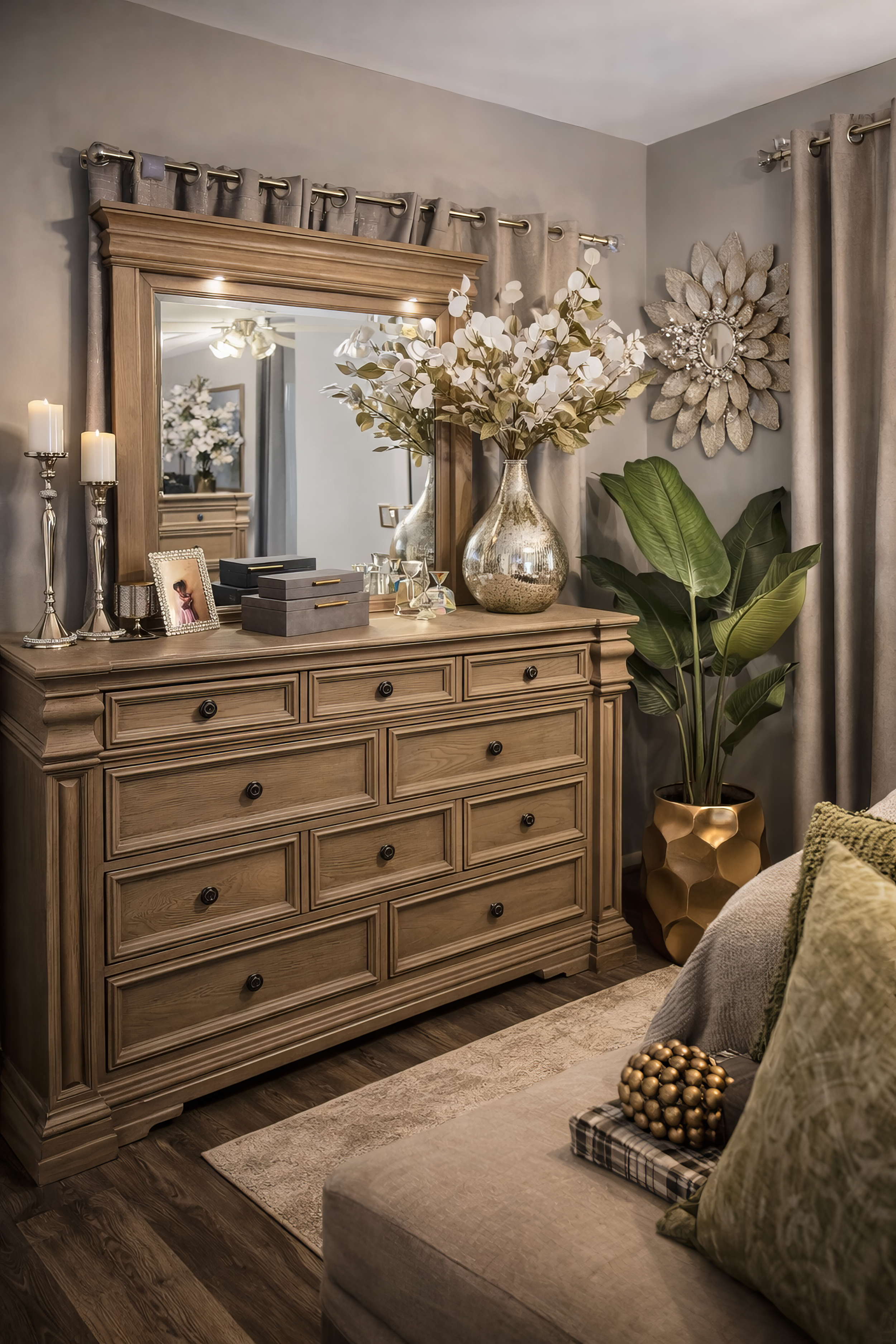 Styled dresser with sculptural lamp and leafy plant in chic editorial interior
