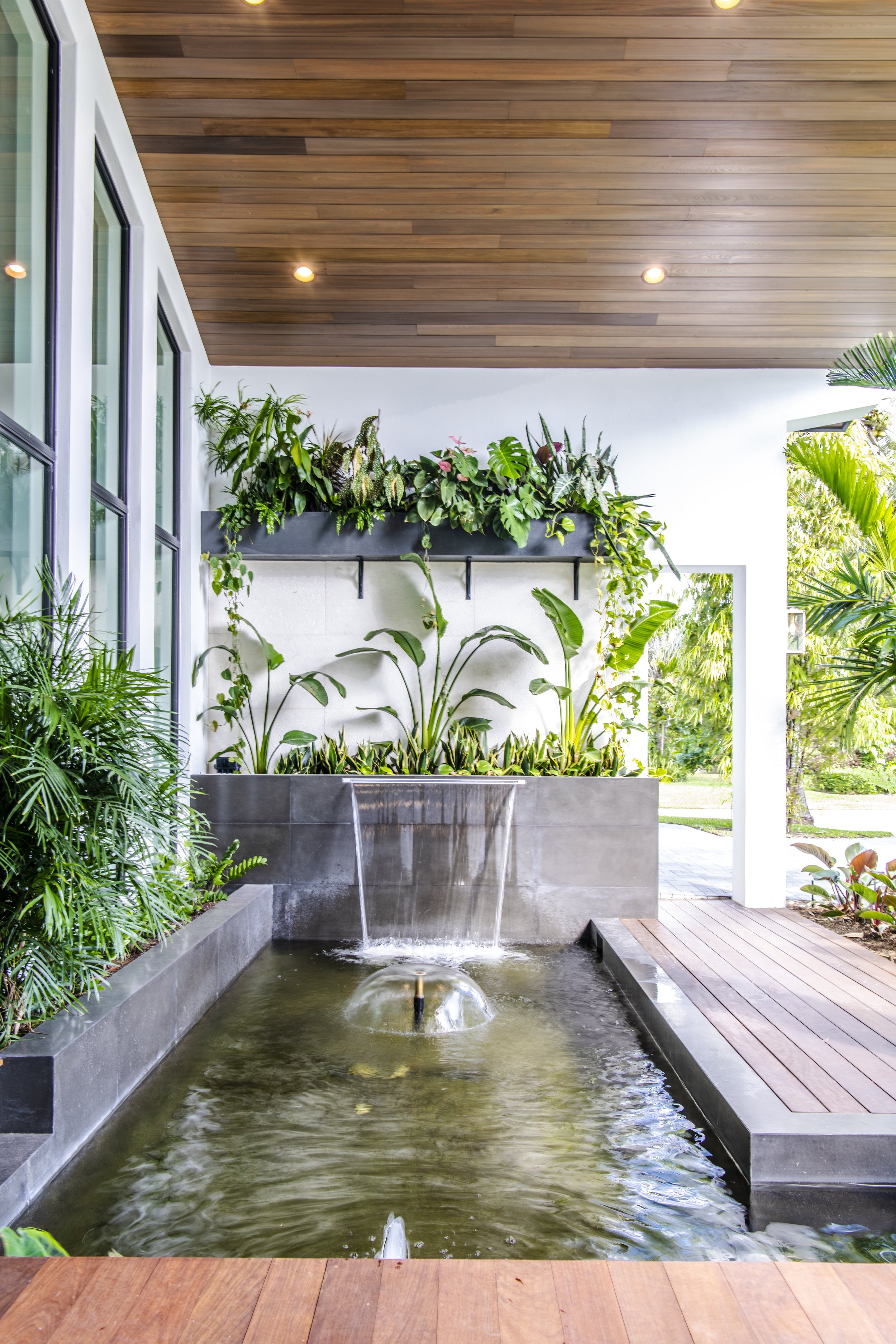 Luxury residential entry with koi pond