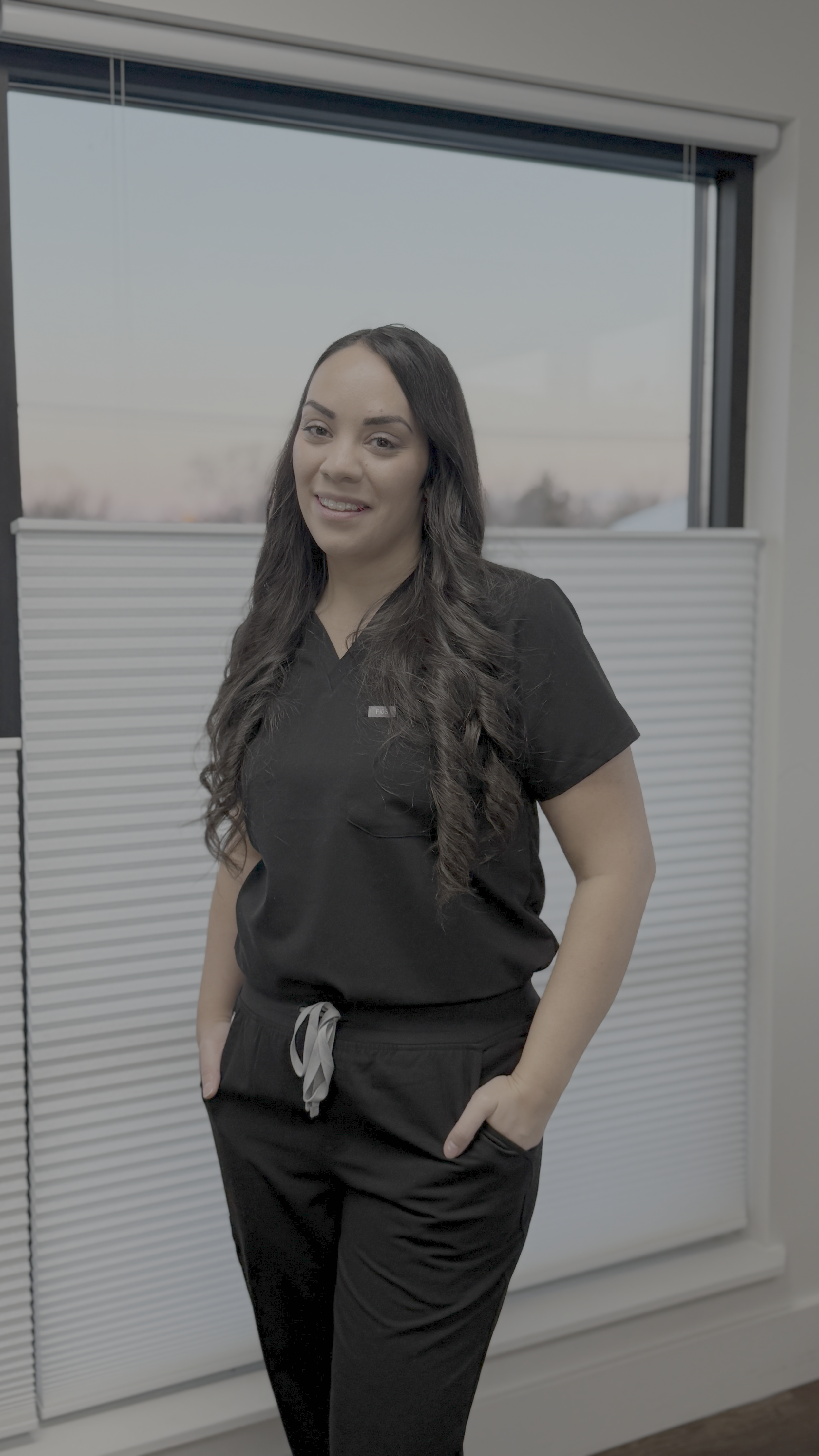A woman in medical scrubs