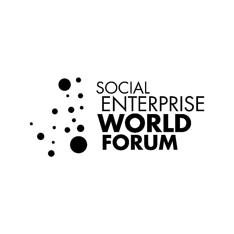 Logo for Social Enterprise World Forum featuring black dots forming a cloud shape and the text 'Social Enterprise World Forum' in black.