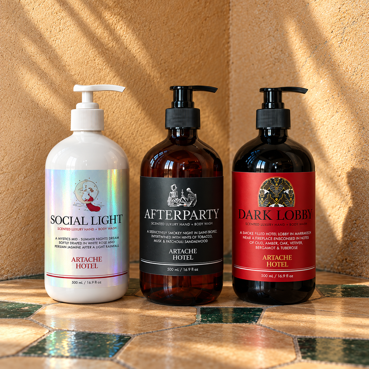 Three bottles of luxury hand and body wash from Artache Hotel are displayed on a patterned surface. The bottles are labeled 'Social Light', 'Afterparty', and 'Dark Lobby'. The bottles vary in color: white, amber, and black, with different label designs and descriptions.