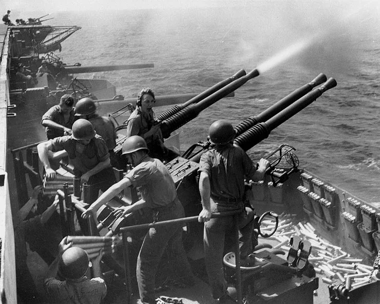 Bofors guns firing (U.S. Navy anti-aircraft practice photo)