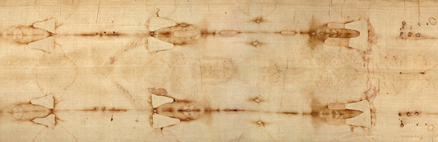Close-up of a wooden surface with burn marks and burn patterns.