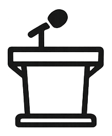 Person standing behind a podium, speaking or presenting
