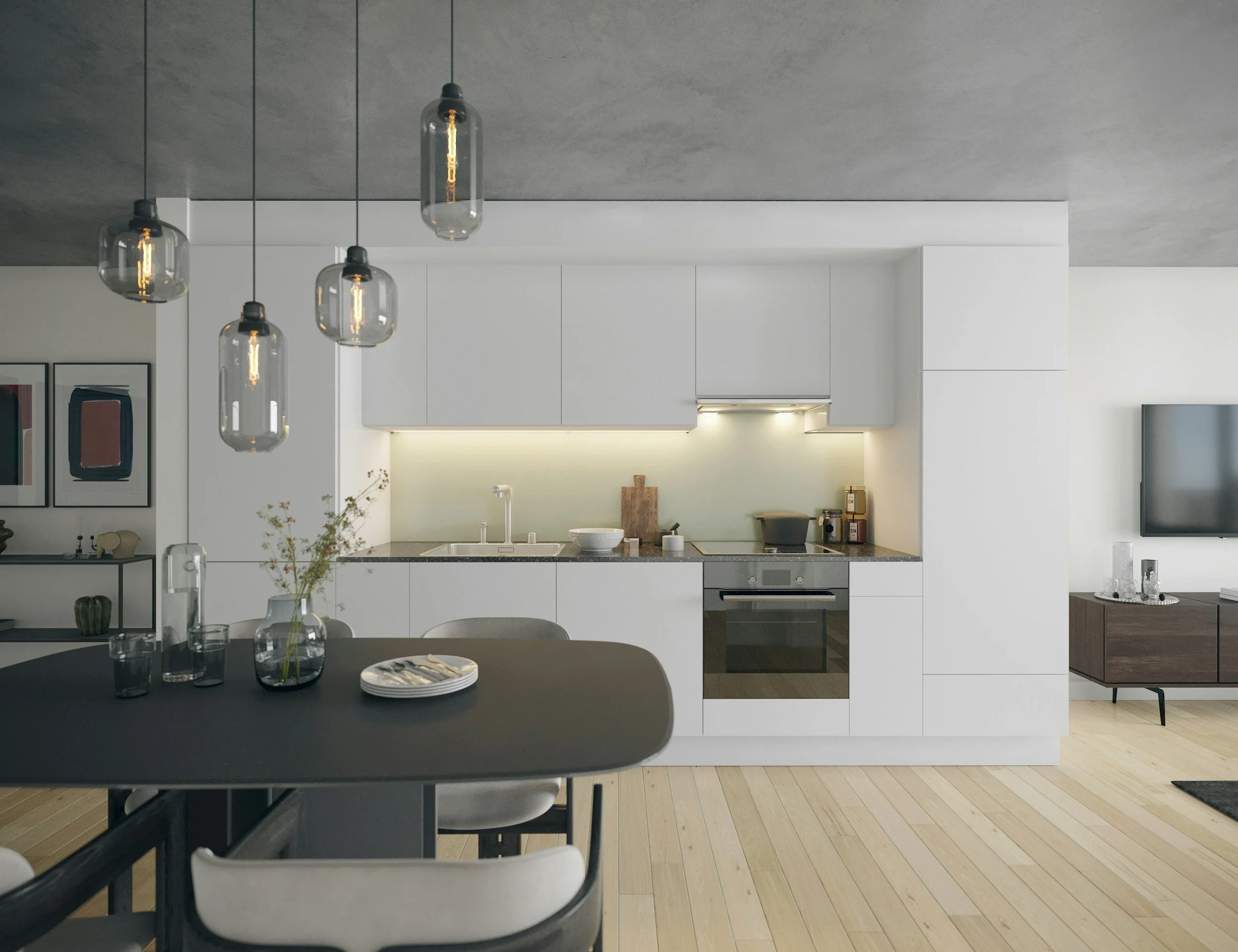 Modern minimalist open-concept kitchen with white cabinets, gray countertop, and built-in oven, adjacent to a dining table with glass vases and a small living area with a wall-mounted TV.