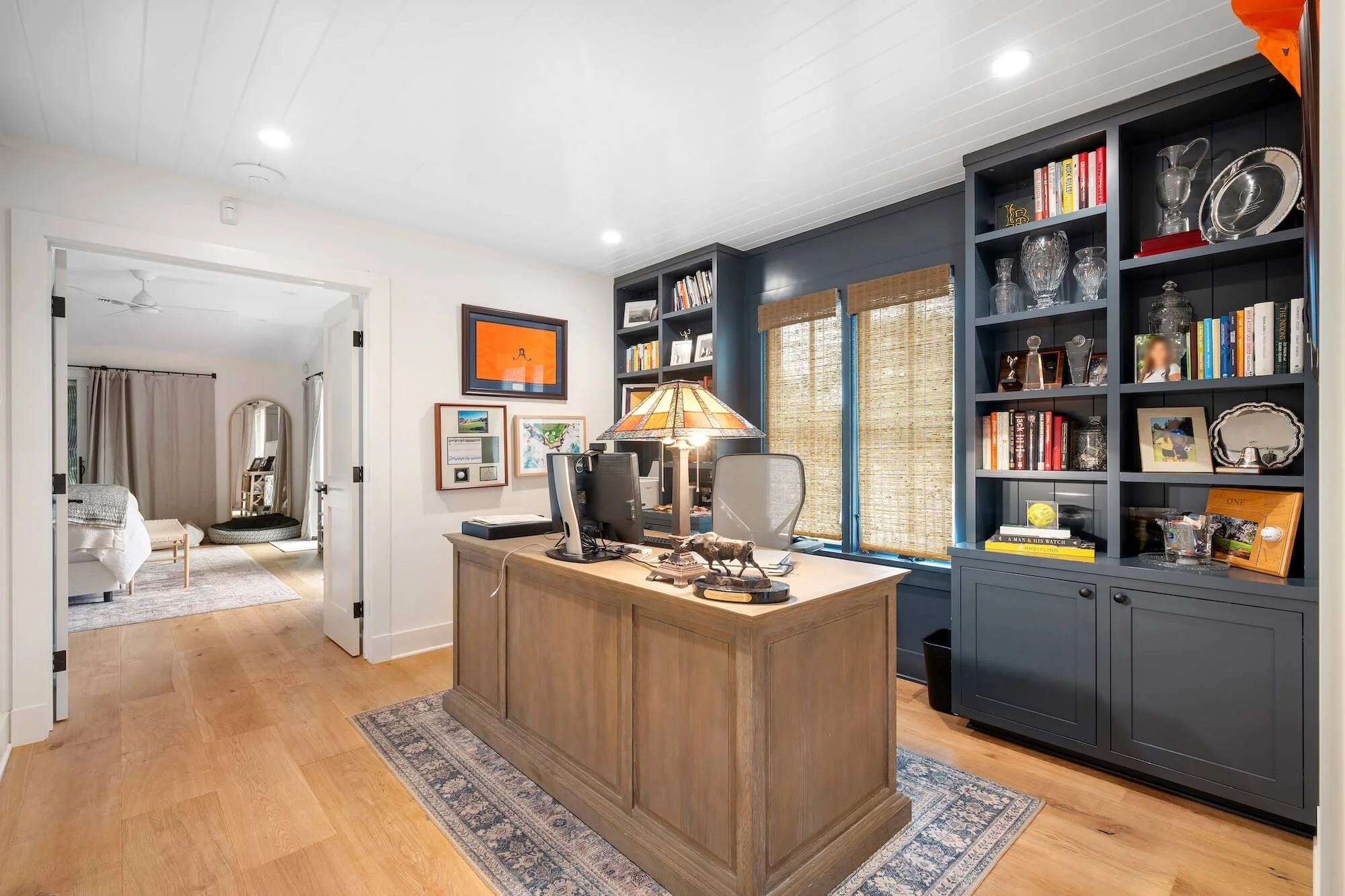 An interior perspective showing the seamless transition from the office den into the bedroom