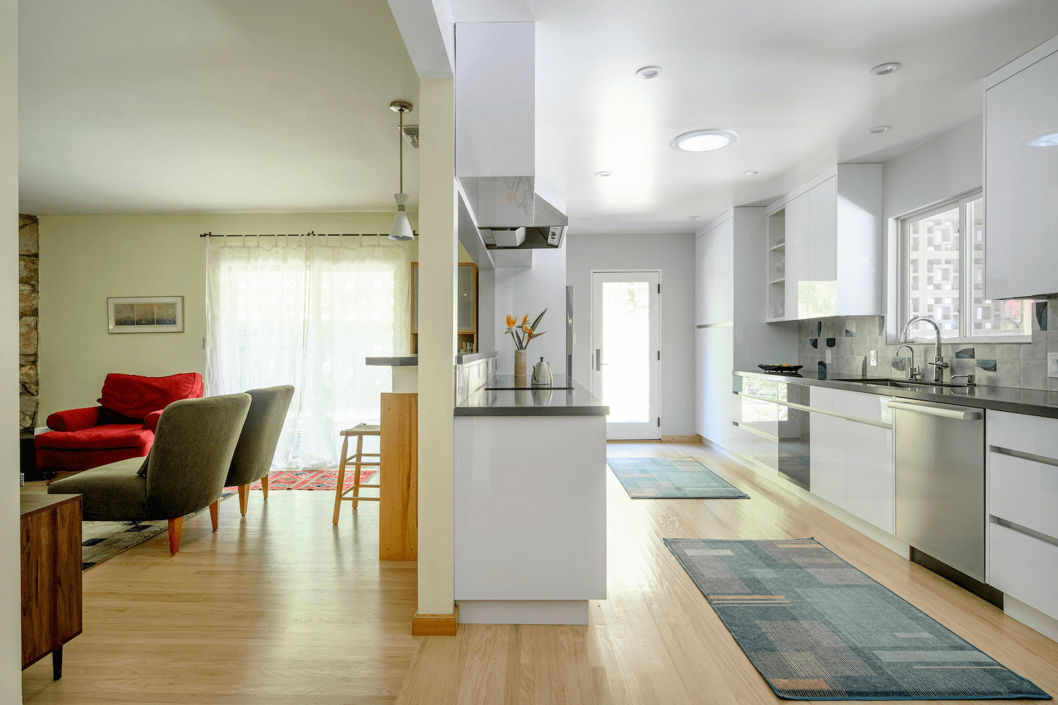 Spatial clarity achieved through the removal of the central closet, allowing the kitchen and family room to breathe as a single volume