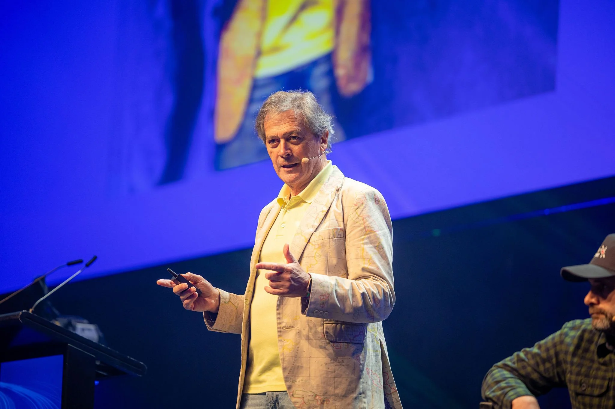 Keynote speaker on stage at Revved