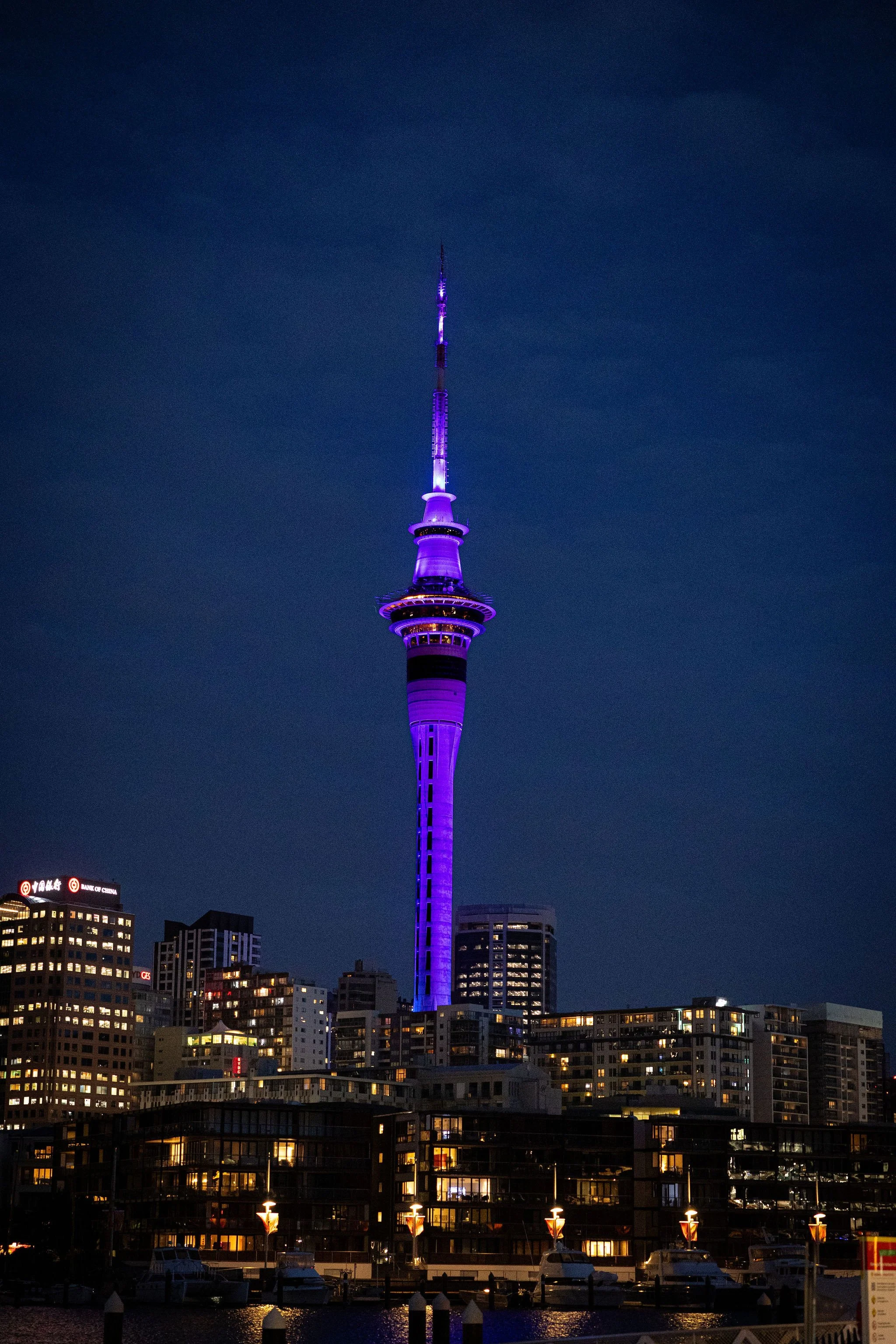 Auckland Skytower illuminated tower with purple lighting for Revved
