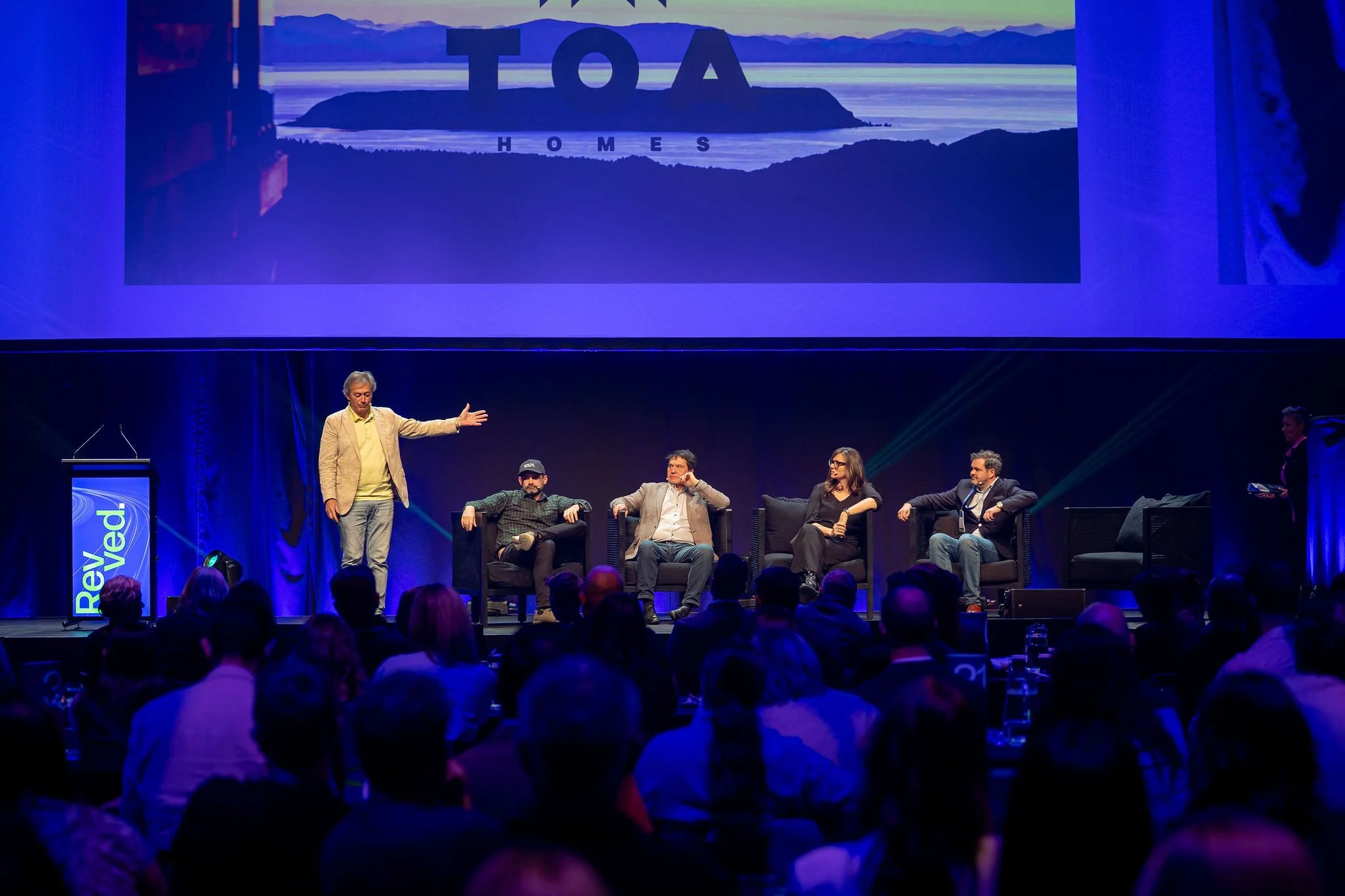 A panel of five people on stage at the Revved conference