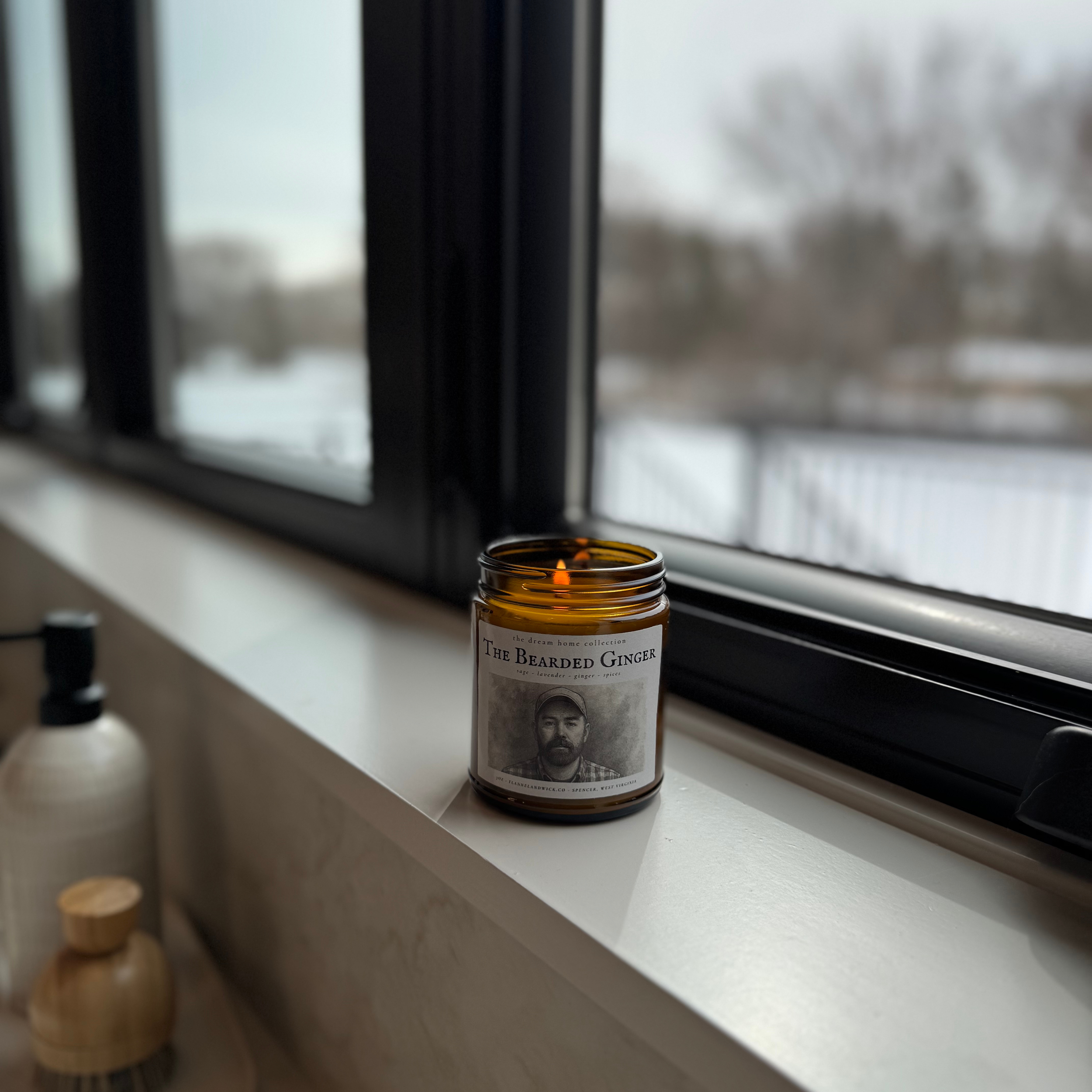 the bearded ginger 7oz soy candle on kitchen window sill.png