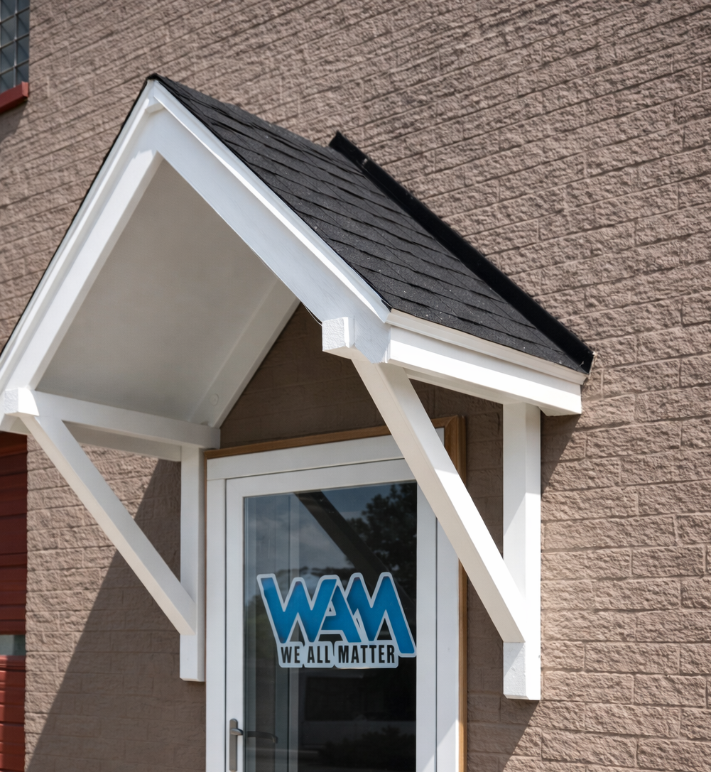 Brick+building+entrance+with+WAM+logo.png