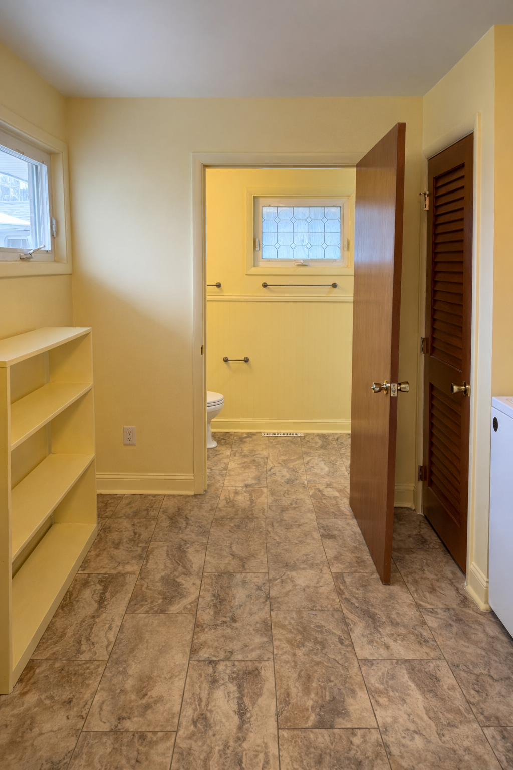 Bright yellow room with open door.png