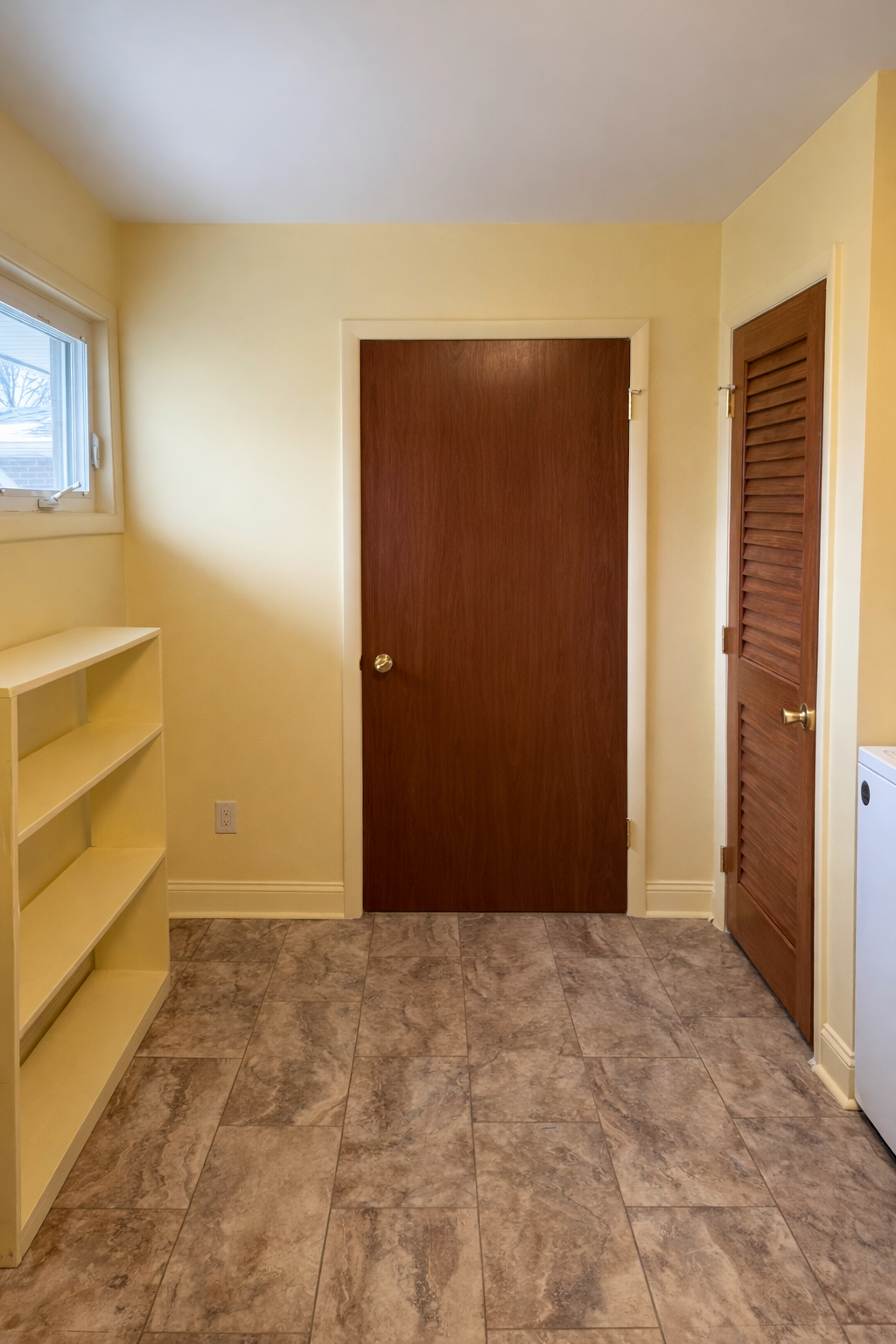 Cozy room with yellow walls and natural light.png