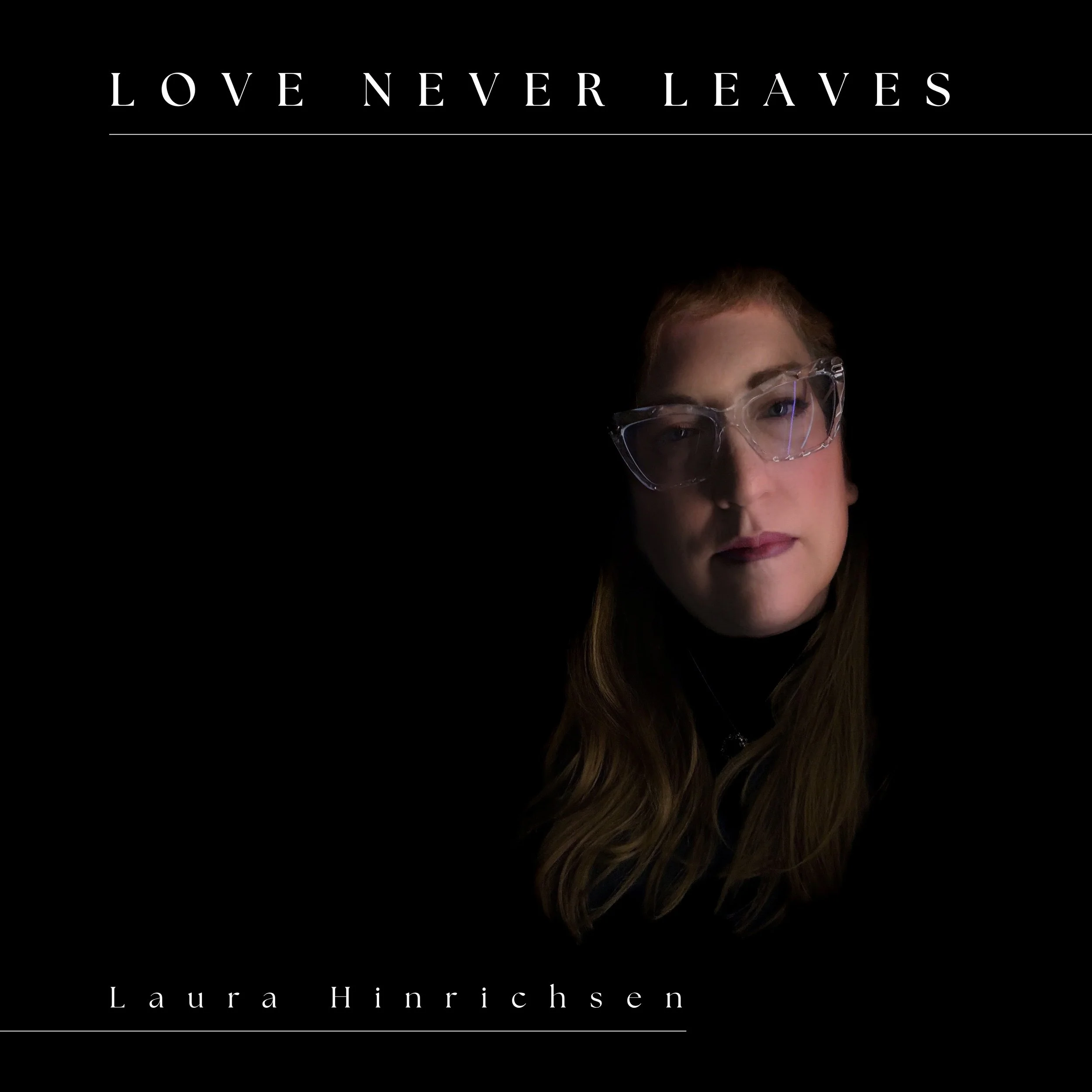Book cover titled 'Love Never Leaves' by Laura Hinrichsen, featuring a woman with long brown hair and glasses against a black background.