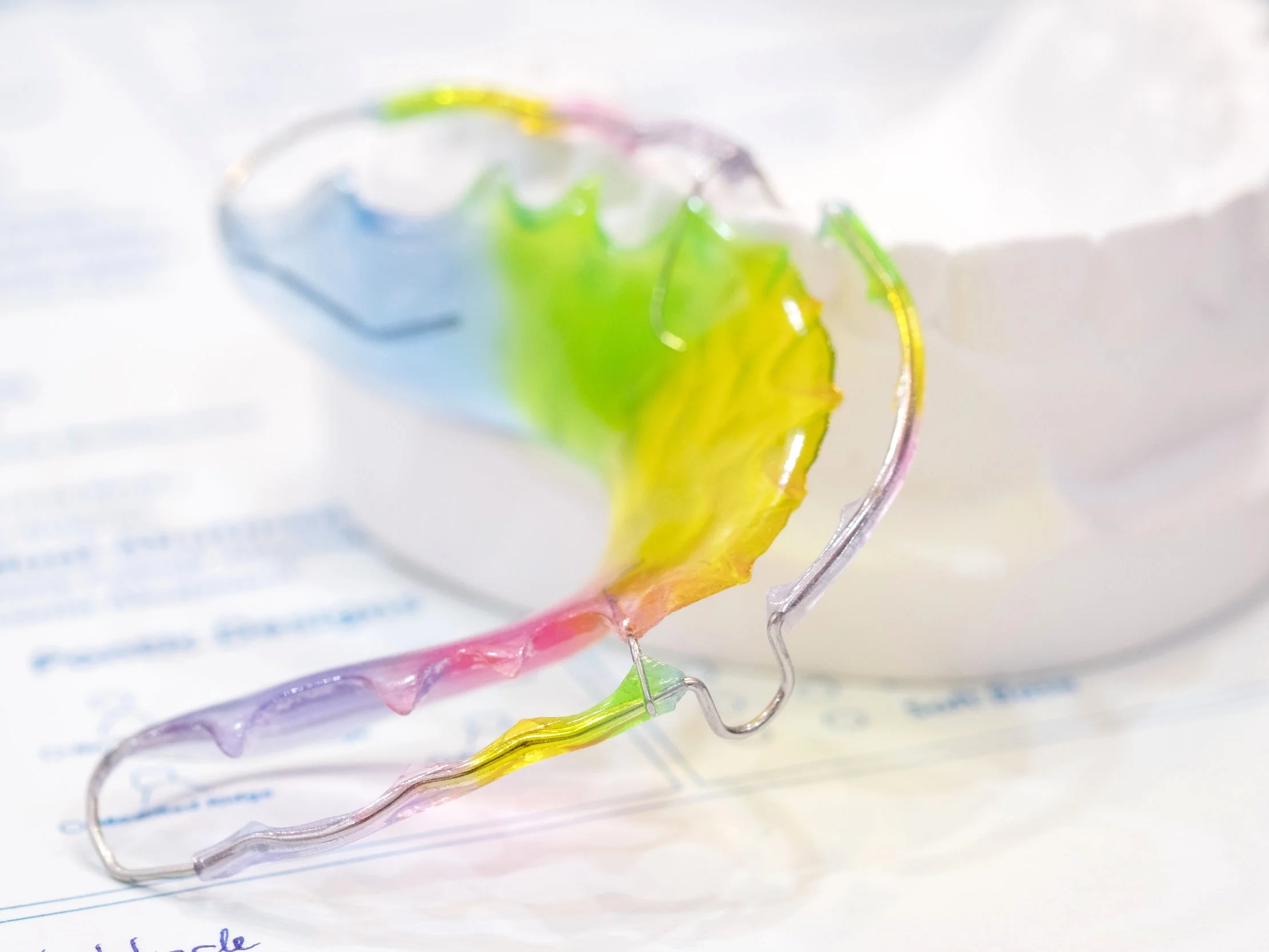 Retainers - Hawley Acrylic with a metal bar, fixed permanent lingual and invisible retainers