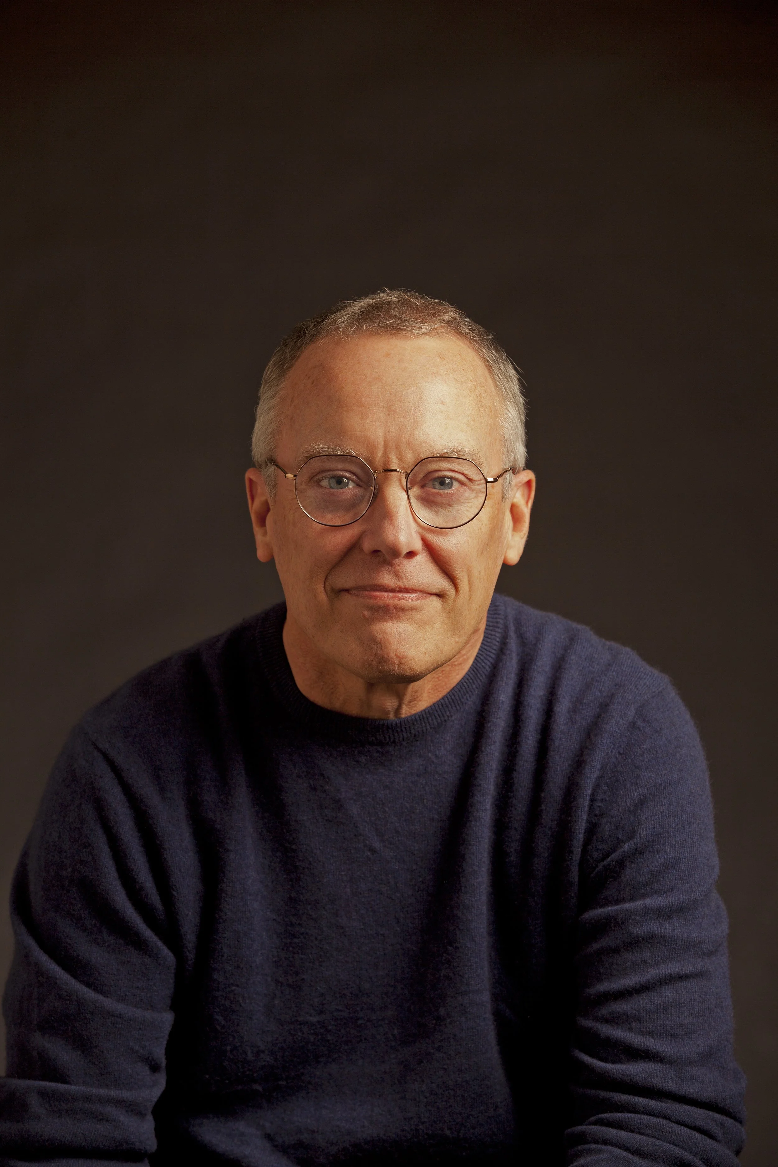 Author Dave Kenney wearing a dark blue sweater