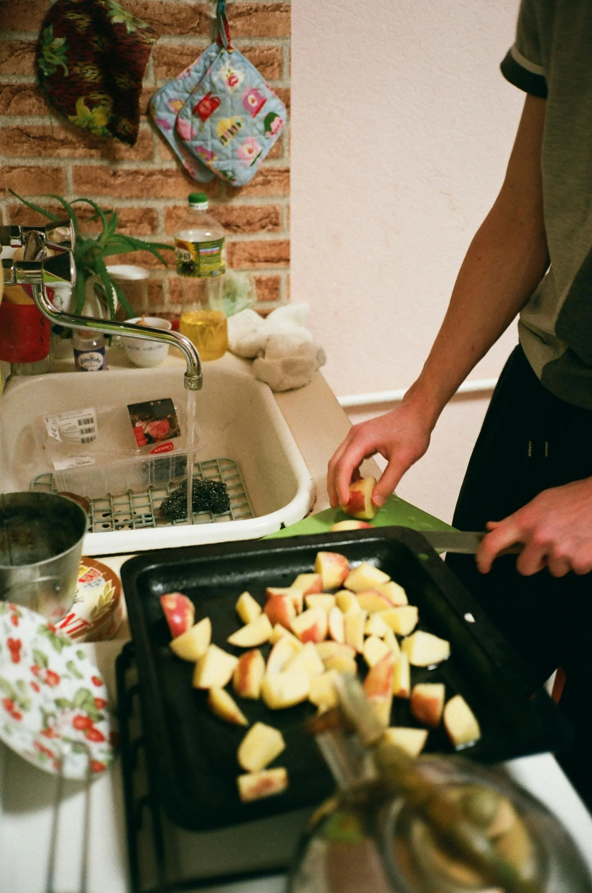 Healthy Sunday meal prep with chopped fruits and vegetables on a kitchen counter.s