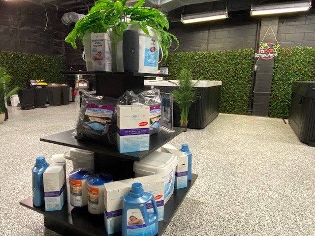 Display stand with hot tub chemicals, in a hot tub showroom, in Windsor ON.
