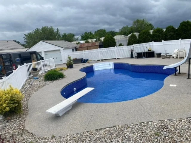 Backyard with a new swimming pool liner installed.