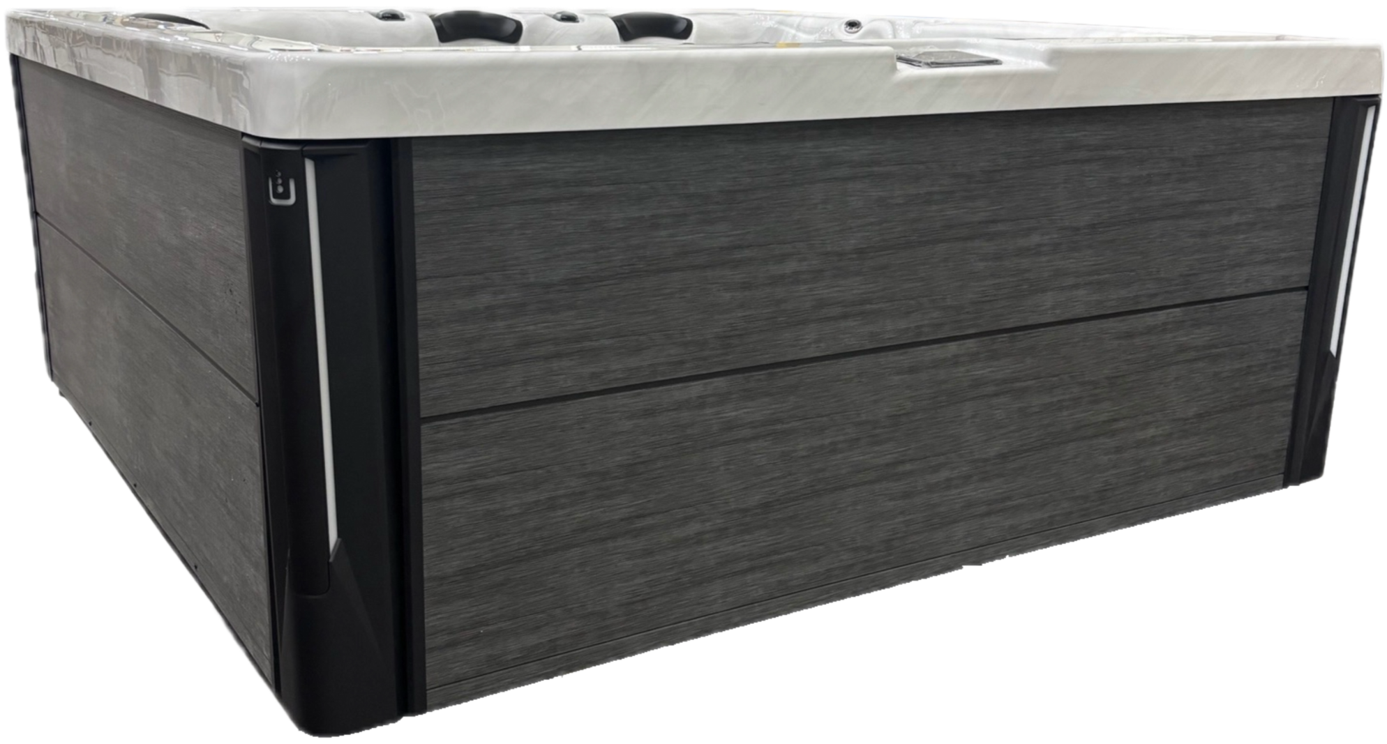 A modern hot tub with a white marble-like exterior and dark wood paneling.