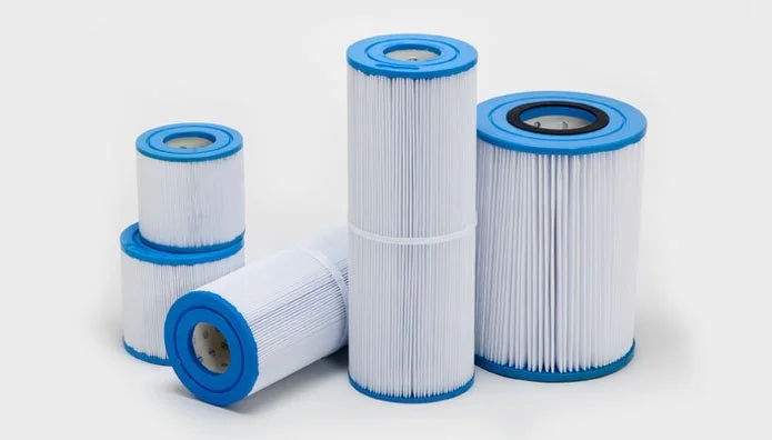 Five white and blue pool or spa filters of various sizes on a white background.