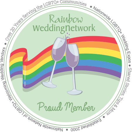 Circular logo for Rainbow Wedding Network featuring two clinking champagne flutes with rainbow rainbow stripes in the background, and text indicating 25 years of service to LGBTQ+ communities, with the phrases 'Rainbow Wedding Network' and 'Proud Member.'