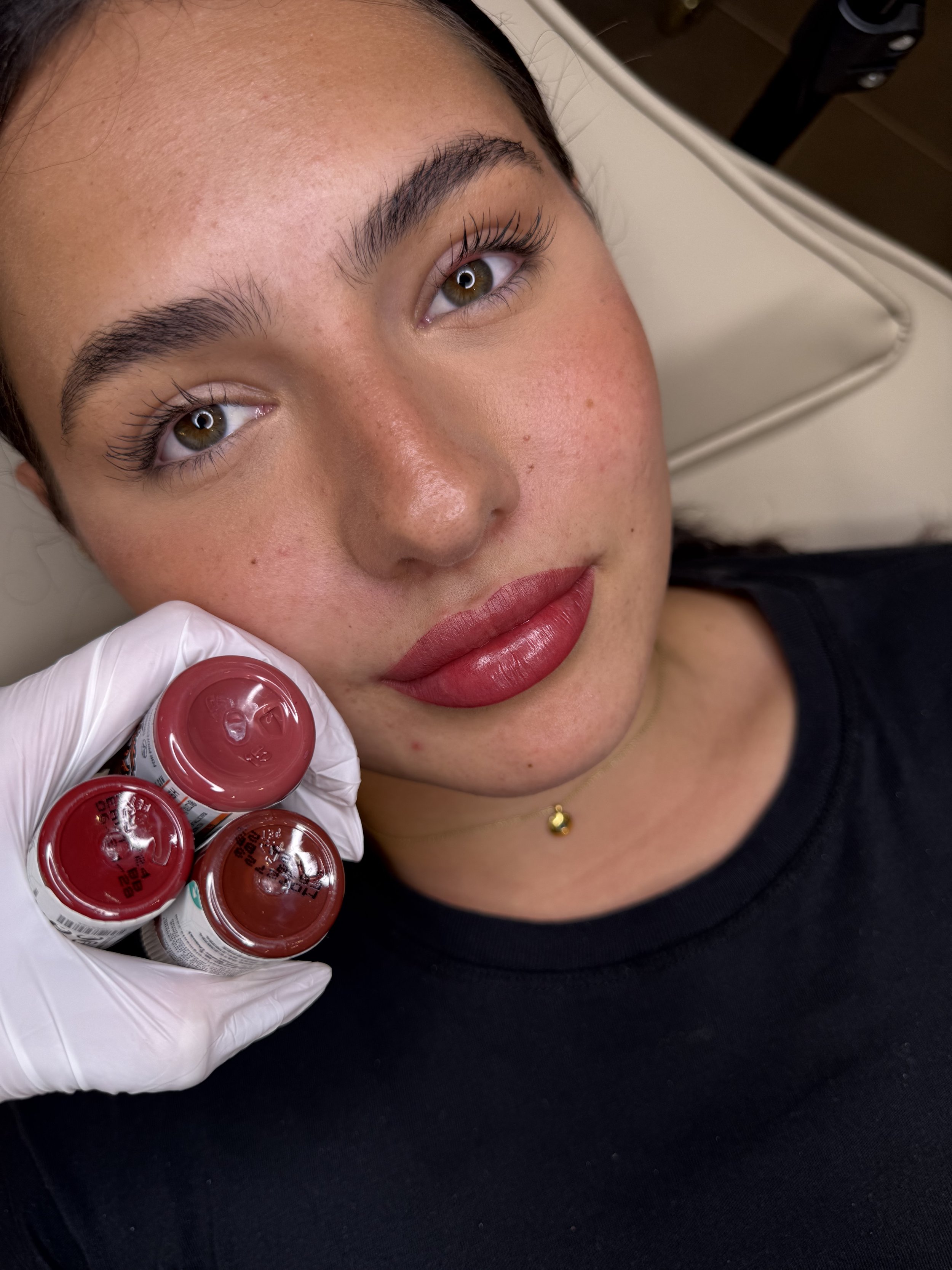 PMU artist performing cosmetic tattoo lip blush treatment in Australia