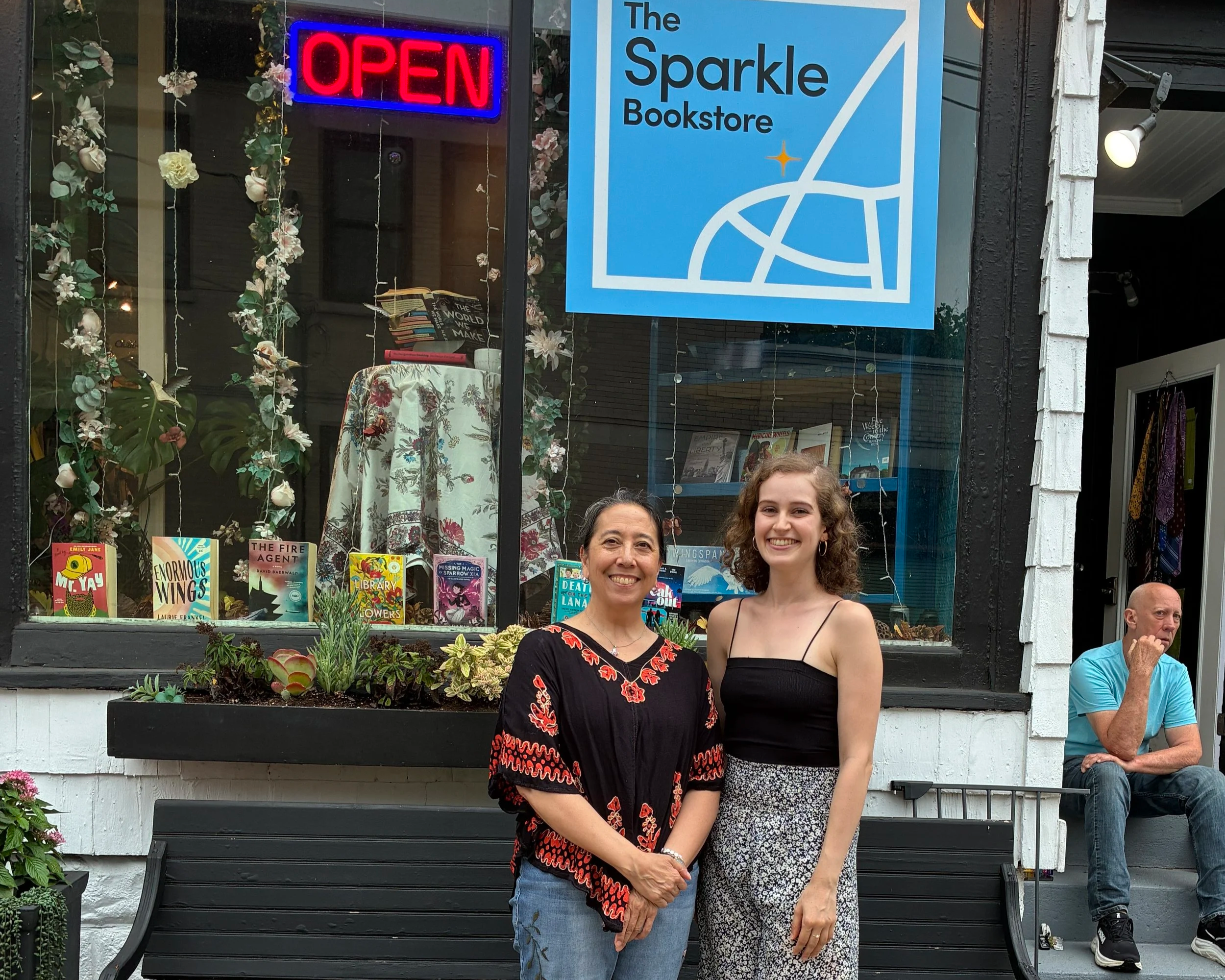 Jacqueline and Donna stand in front of The Sparkle Bookstore.