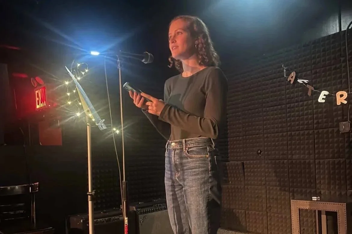 Jacqueline reads her writing onstage at KGB Bar.