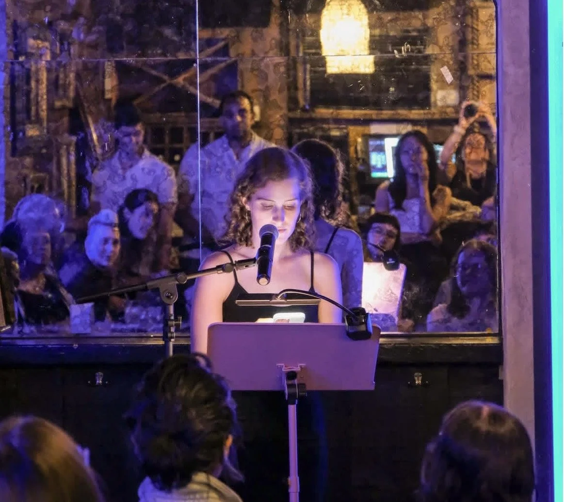 Close-up of Jacqueline reading her work. 