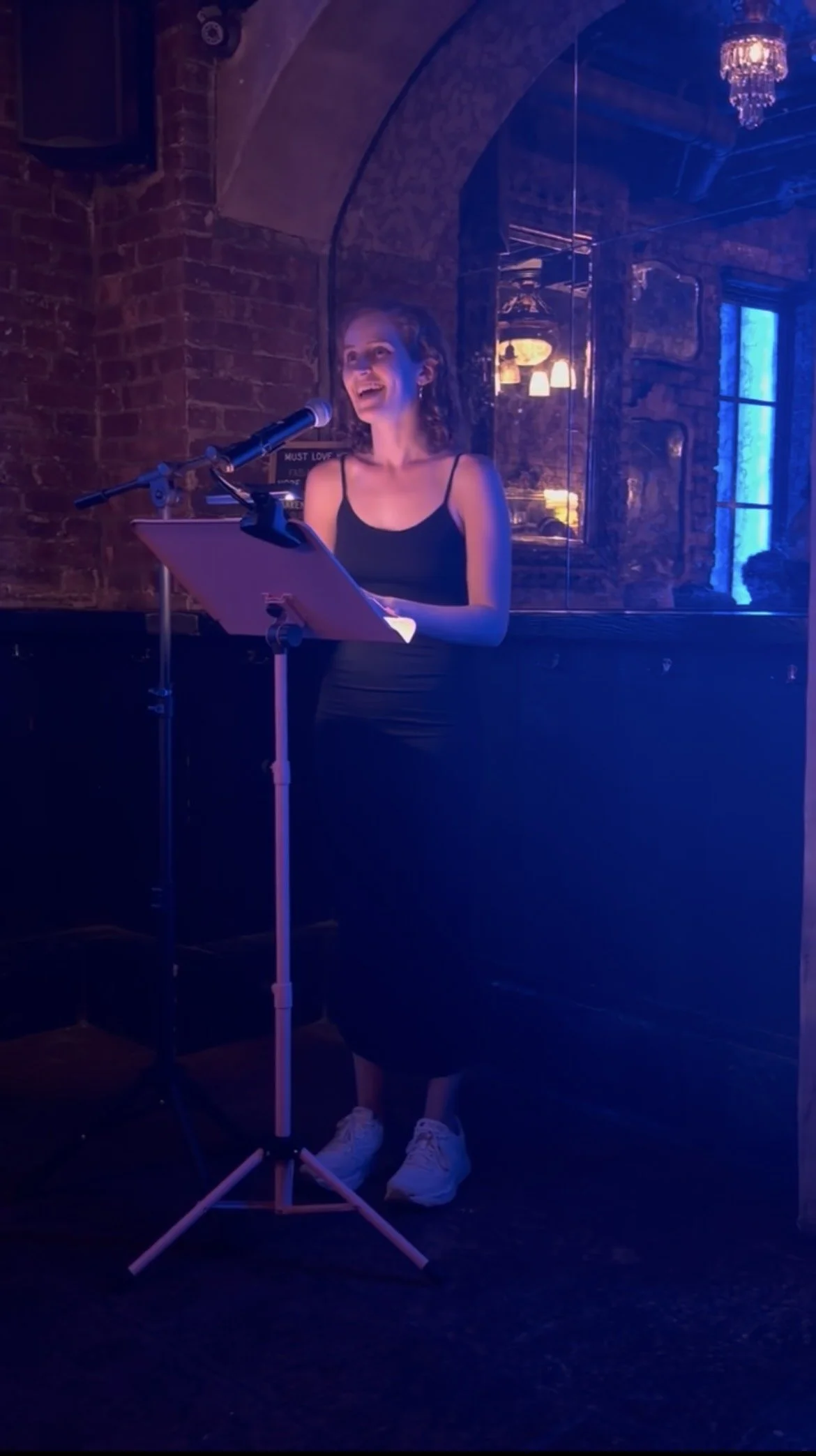 Jacqueline laughs as she reads a funny passage.