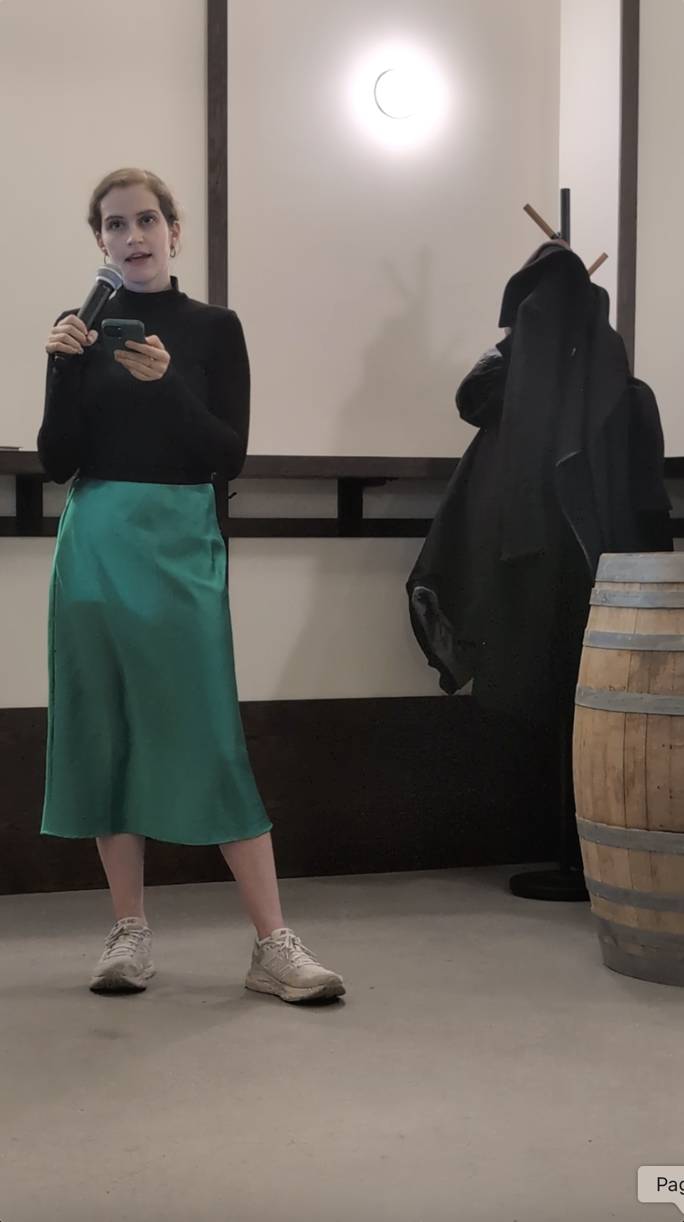 Jacqueline reads to the audience.