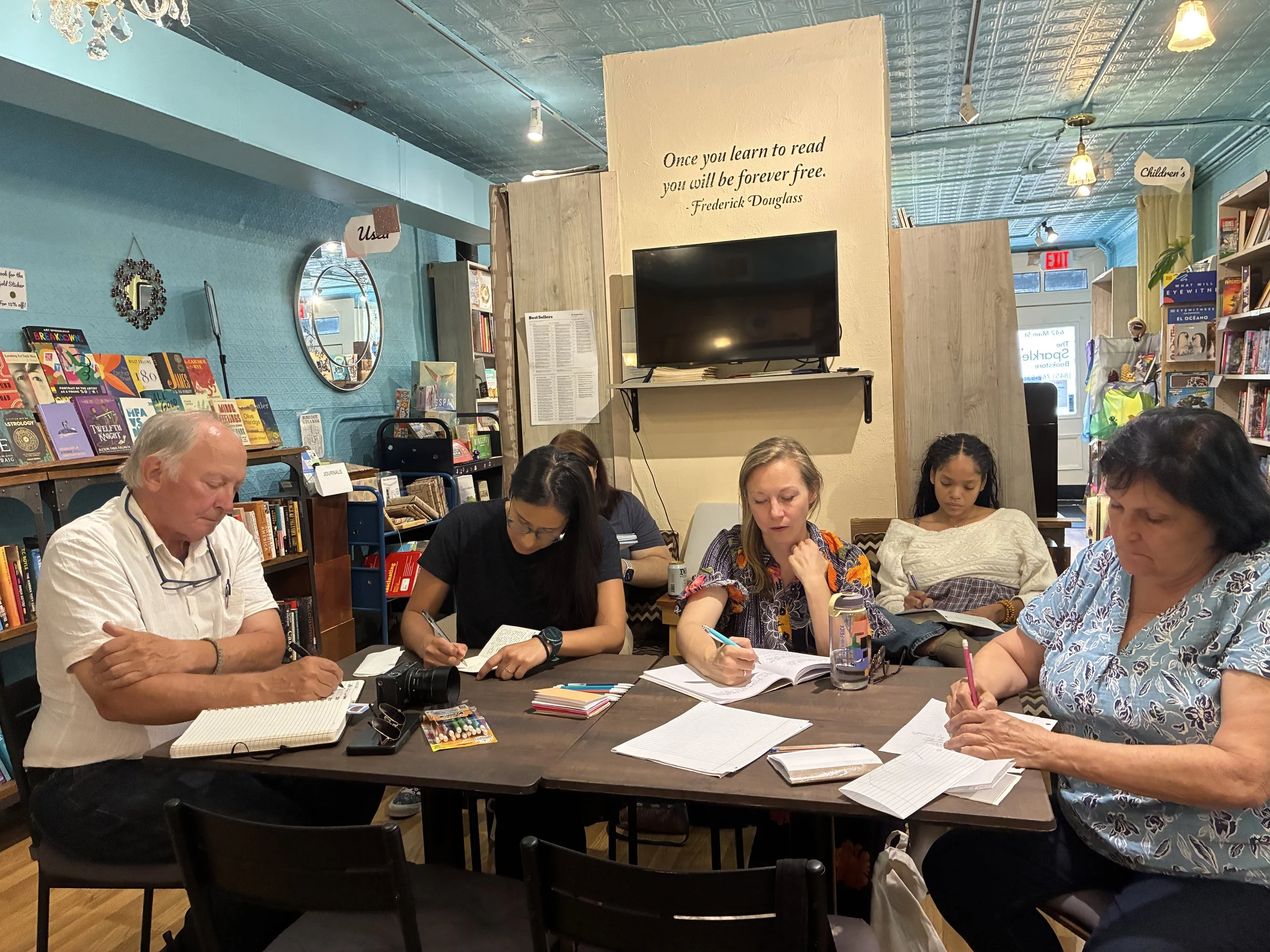 Writers attending Jacqueline's workshop write together.