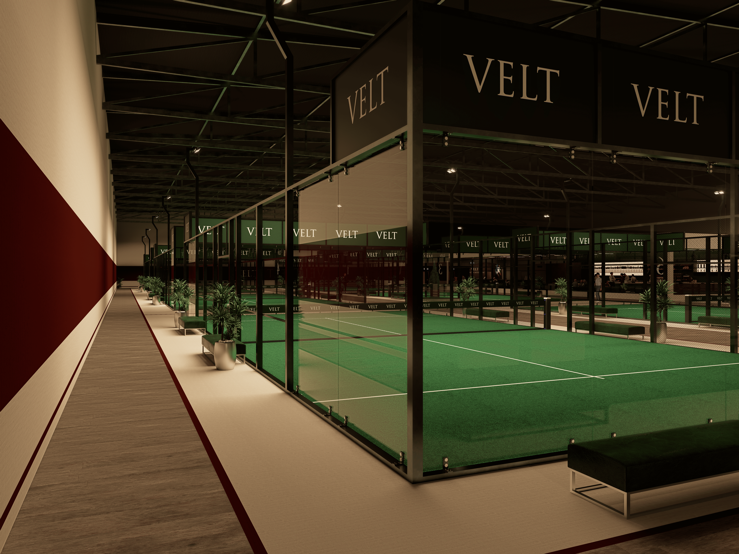 Indoor sports facility with a synthetic tennis or paddle court surrounded by glass panels, potted plants, and seating areas, with dark ceiling and illuminated signs reading 'VELT'.