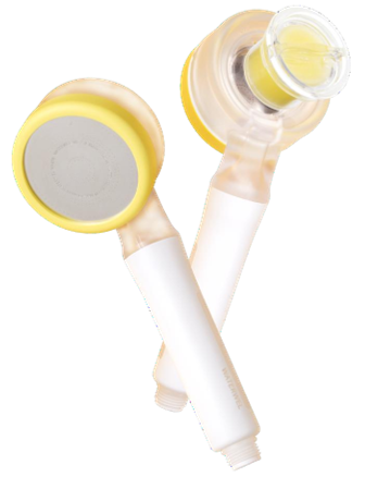 Close-up of two skincare roll-on bottles with white handles and clear caps.