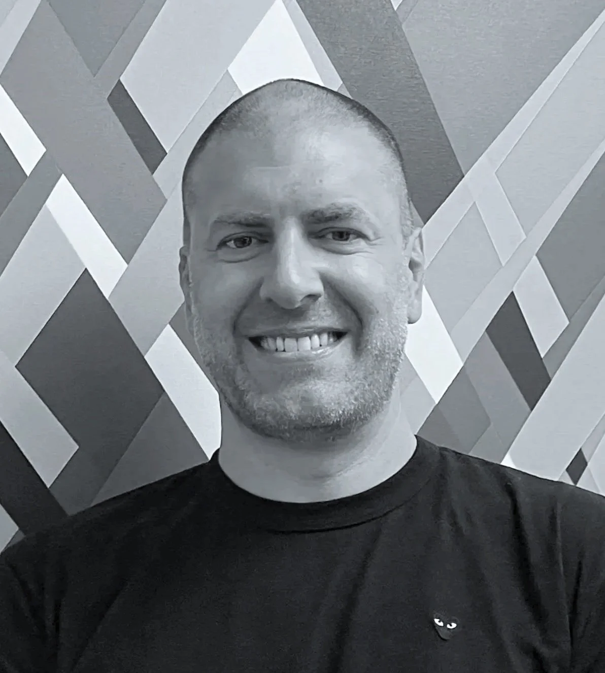 Danny Jacobson, Abstract Artist and Industrial Designer. Co-Founder Studio Jacobson. Standing in front of one of his Art Works