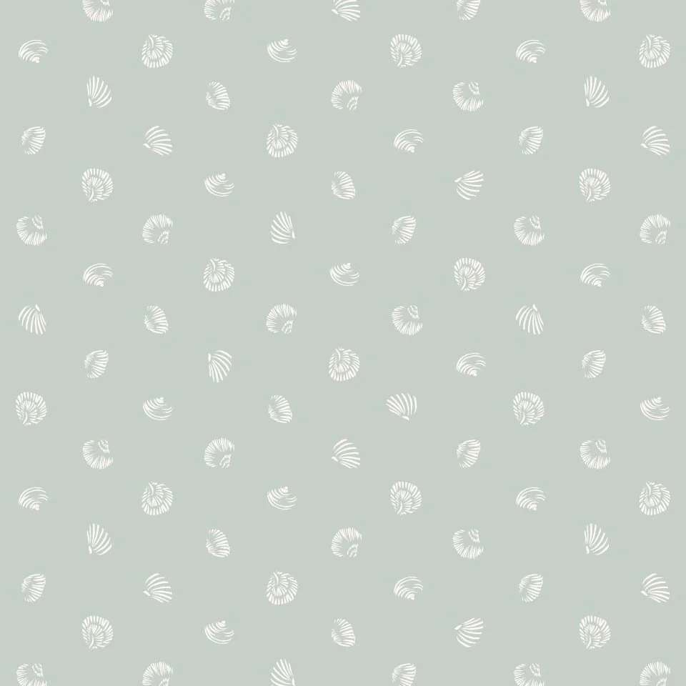 Tiny Shell Toss: Small-scale tossed repeat featuring hand-drawn tiny seashells in cream on a soft, pale sage background. Designed as a subtle coastal coordinate for wallpaper, textiles, home decor, and interior pattern collections.