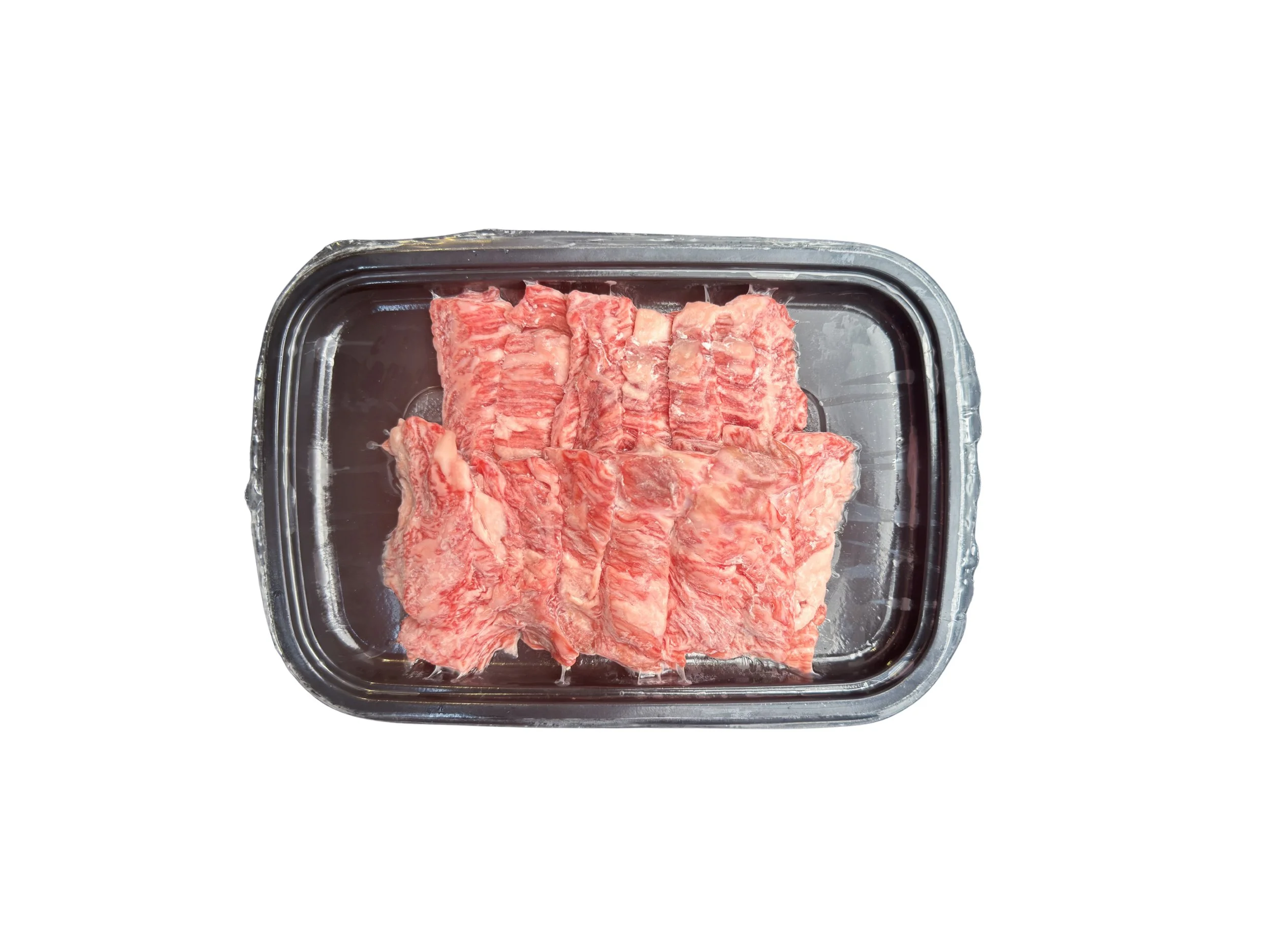 Slices of Halal Japanese Wagyu A5 Karubi Yakiniku with heavy marbling.