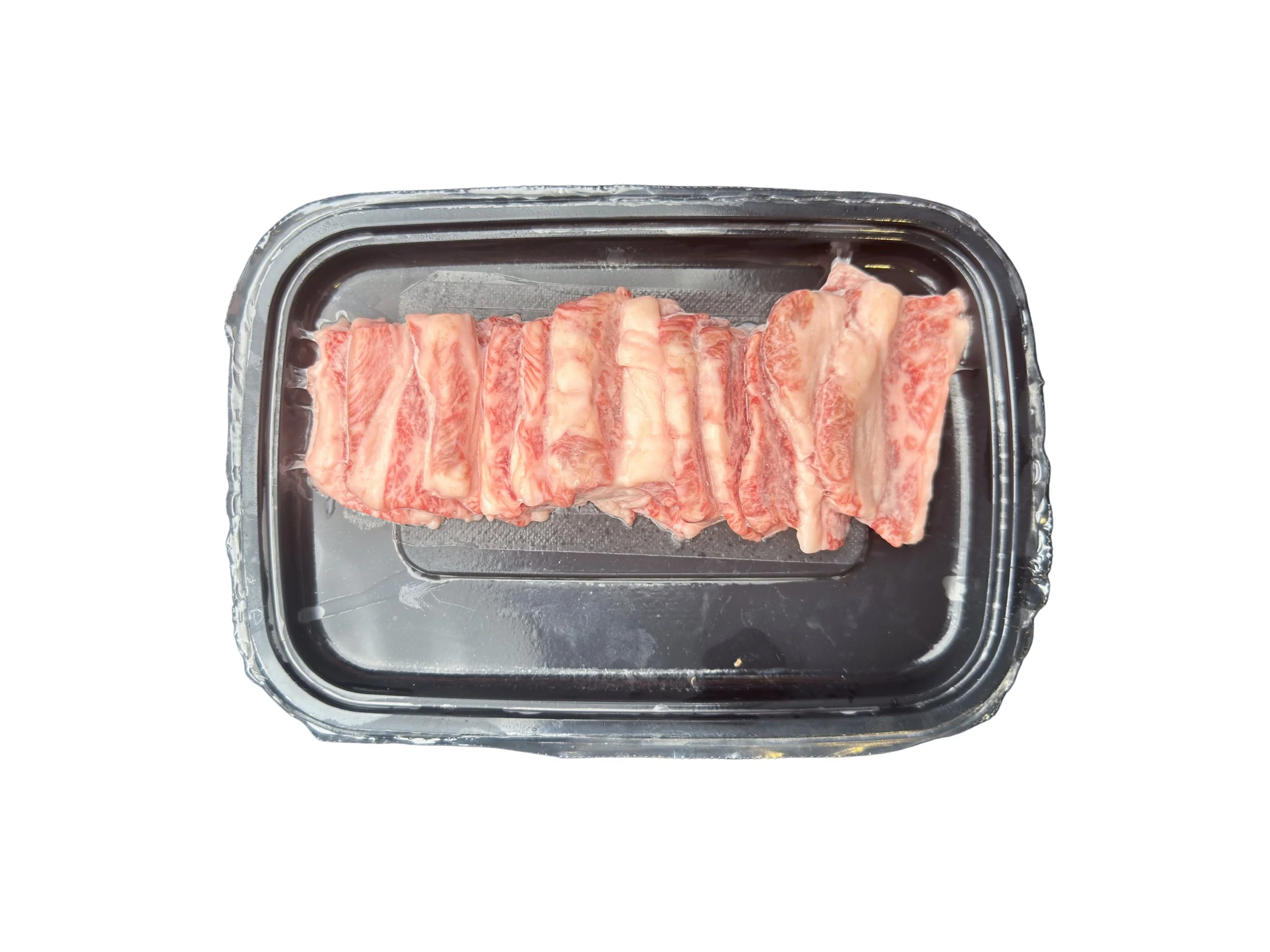 Slices of Halal Japanese Wagyu A5 Karubi Yakiniku with heavy marbling.