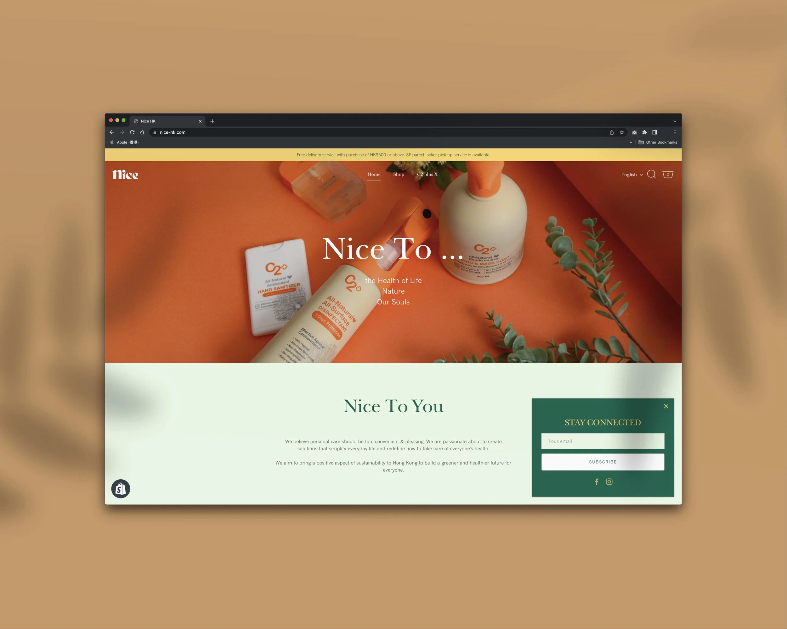 Screenshot of a website homepage for Nice, featuring natural hand sanitizers and disinfectants with a background of orange and green accents.