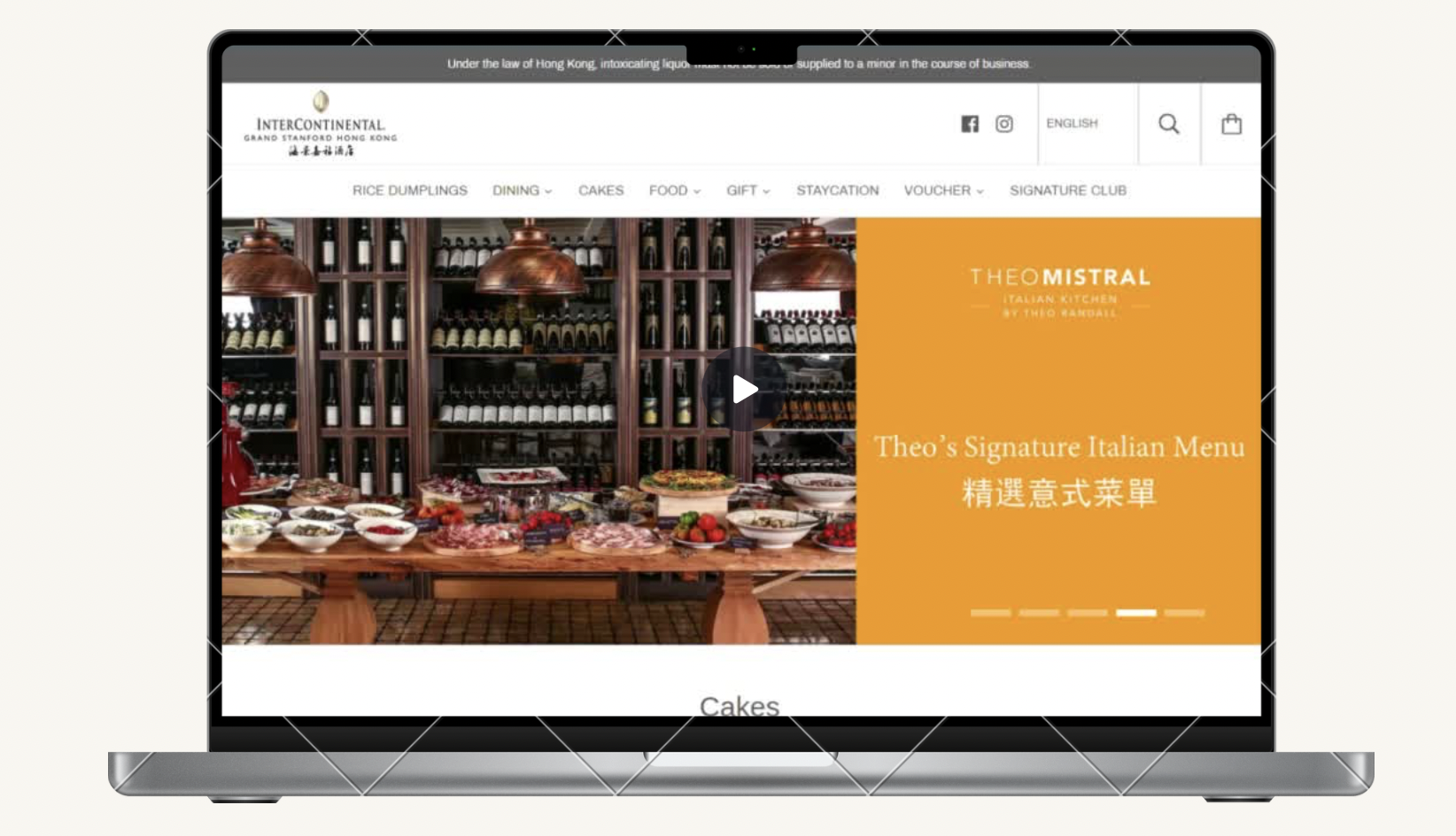 Laptop screen displaying the menu of a restaurant called Intercontinental Grand Stanford Hong Kong, featuring an Italian menu section with a background image of a wine shelf and a table with bowls of food and fruits.