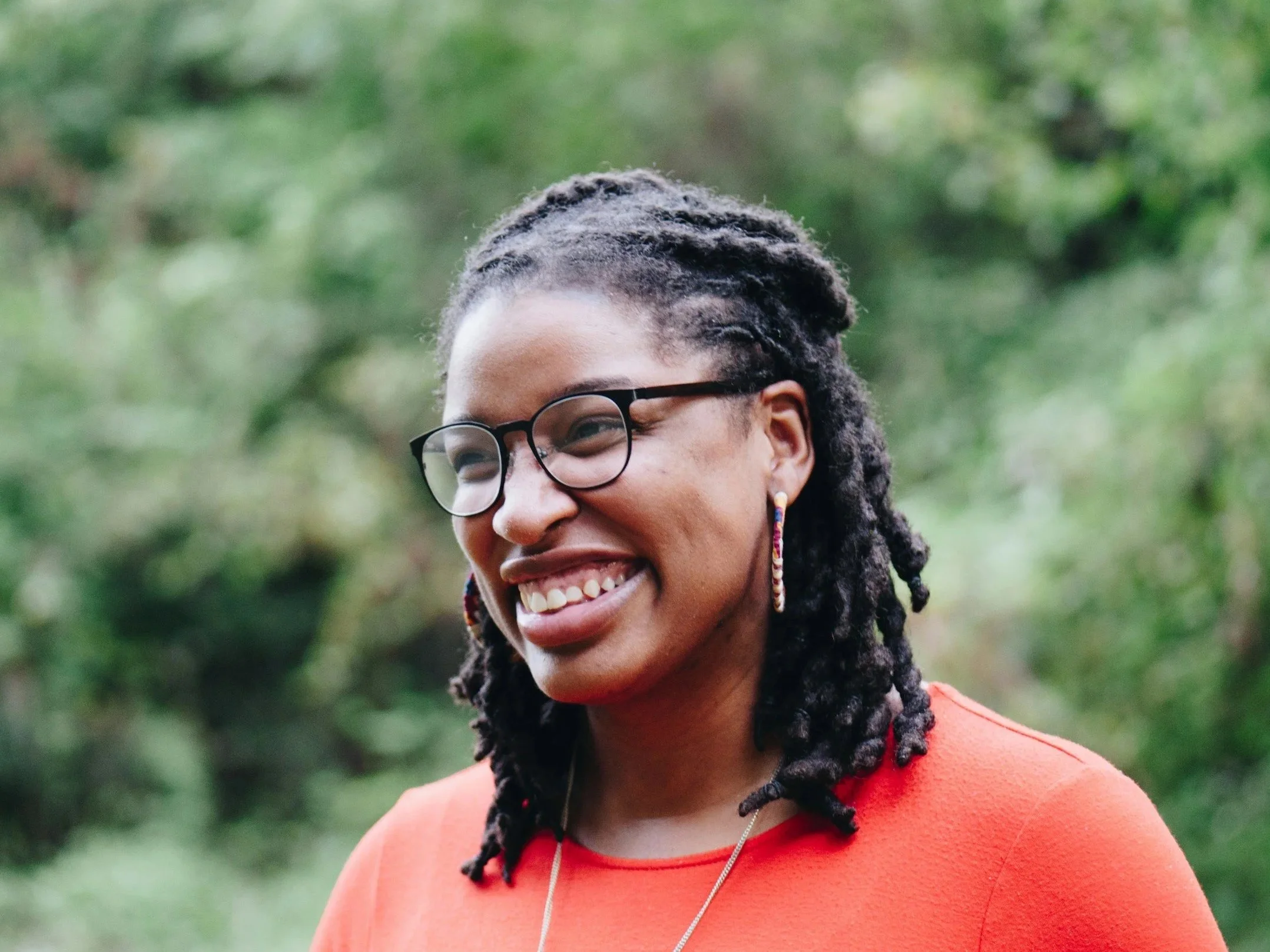 close up of woman smiling, feeling confident about her fertility